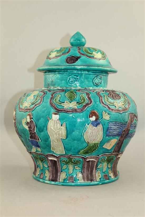 A Chinese Fahua decorated baluster jar and cover, 18th / 19th century, 32cm.